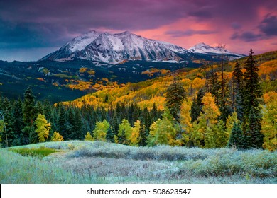 Fall rushes in to Colorado in the form of snow and frost at sunrise along Kebler Pass in Crested Butte as East Beckwith Mountain is covered in a fresh dusting.