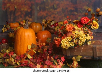 Fall Scene With Pumpkins And Colored Leaves