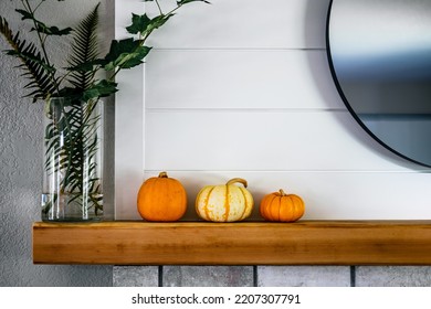 Fall Season Holiday Decor Pumpkins On Fire Mantle With Ship Lap Abs Round Mirror.