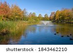 Fall season in a public park lake and trees Gresham Oregon.