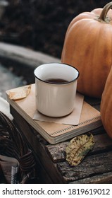 Fall styled composition. Autumn breakfast still life. Scandinavian hygge concept. Morning concept. Cozy autumn scene with pumpkins and apples. Flat lay. Home decor.