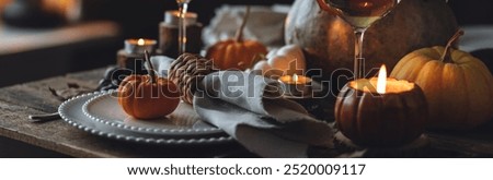 Fall table decoration with pumpkins, wine. Family cozy thanksgiving dinner arrangement indoors at home, wedding elegant decor. Countryside style, simple handmade setting, autumn mood banner