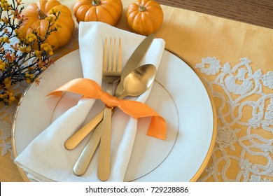 Fall Thanksgiving Or Halloween Table Place Setting And Pumpkins In Gold Tones. Horizontal With Natural Lighting From Above, Looking Down View. Has Room Or Space For Copy, Text, Words Or Design On Side