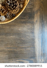 Fall Theme Flat Lay With Dark Wood Background Rustic Basket Filled With Pinecones And Acorns And Copy Space
