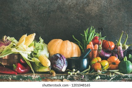 Fall Vegetarian Food Ingredient Variety. Assortment Of Various Autumn Vegetables For Healthy Cooking Over Rustic Cupboard, Dark Wall Background, Copy Space. Local Market Organic Produce