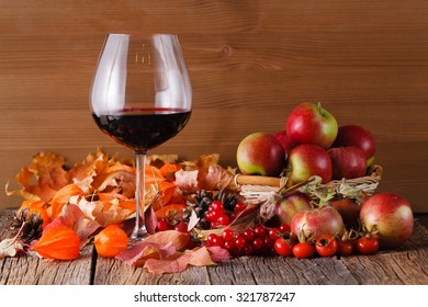 Fall Wine With Harvest On Rustic Wooden Background