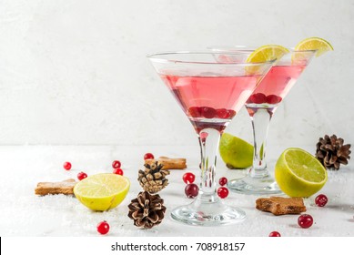 Fall And Winter Drinks. Christmas Holiday Beverage. Festive Cranberry Martini With Lime. On White Table With Christmas Decoration, Copy Space