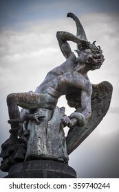 fallen angel, devil figure, bronze sculpture with demonic gargoyles and monsters