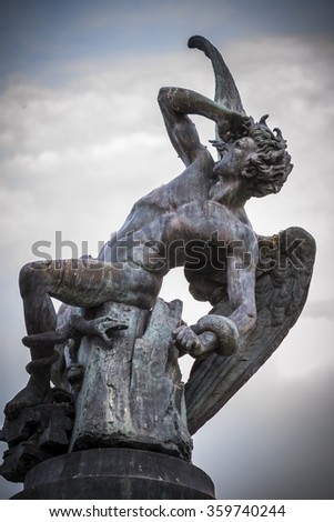 fallen angel, devil figure, bronze sculpture with demonic gargoyles and monsters
