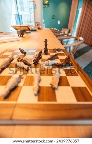 Fallen chess pieces representing a winner being the king of the game