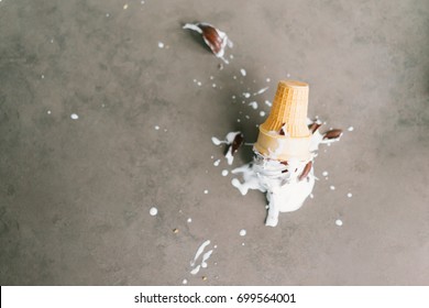 Fallen chocolate ice-cream in restaurant.ice cream cone fall to the ground 