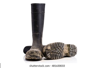 Fallen Dry Dirty Mud Boots Isolated On Pure White Background