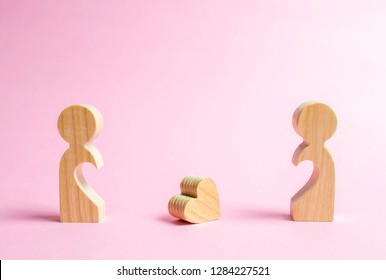 A fallen heart lies between two former lovers. The concept of separation or divorce. Reunion and restoration of love relationships. Search for a love partner or loved one. Dating on Valentine's Day.