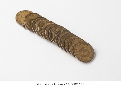 A fallen stack of 10 Pfenig German coins