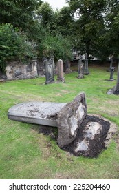 Fallen tombstone - Shutterstock ID 225204460