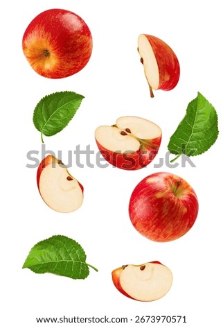 Falling apple segments and leaves create a dynamic composition, symbolizing the freshness and natural goodness of autumn harvest.