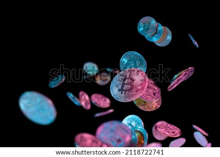 falling bitcoins with blue and pink light on dark background