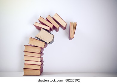 Falling Books On Simple Background