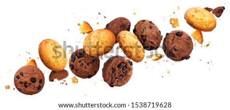 Falling broken chocolate and vanilla chip cookies isolated on white background with clipping path, flying biscuits collection