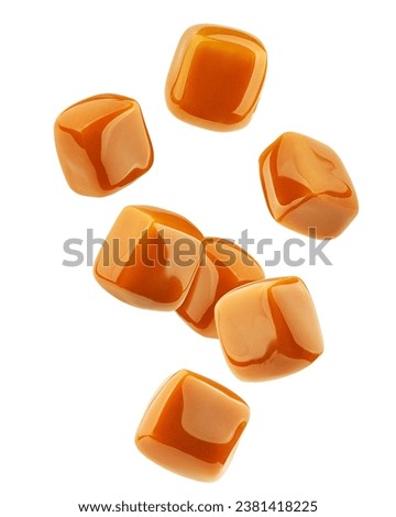 Falling Caramel candy, isolated on white background, clipping path, full depth of field