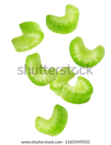 Falling celery slice isolated on white background, clipping path, full depth of field