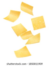 Falling cheese slices, isolated on white background, clipping path, full depth of field