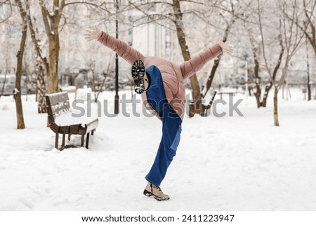 Falling Child Teen in Snow Winter Street. Little Girl Slips and Falls. Accident Insurance in Winter.