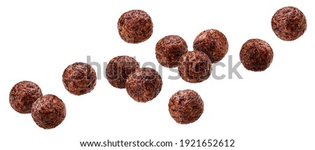 Falling chocolate corn balls isolated on white background with clipping path