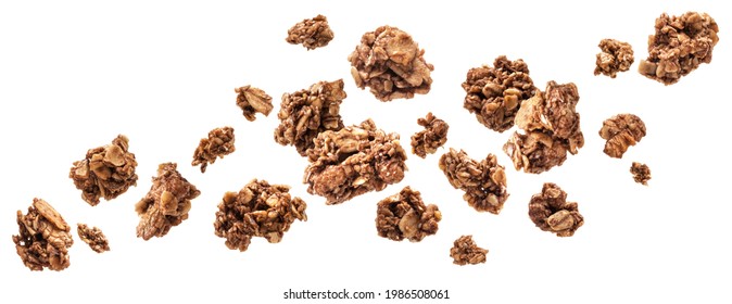 Falling chocolate granola, crunchy muesli isolated on white background with clipping path - Shutterstock ID 1986508061