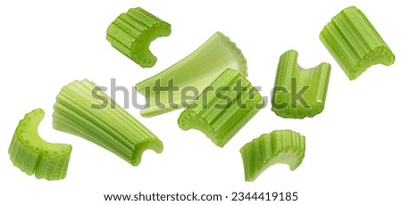 Falling chopped celery isolated on white background with clipping path