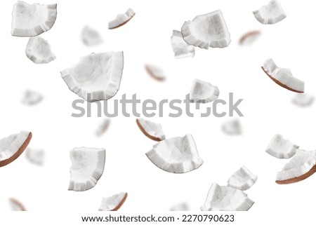 Falling coconut, isolated on white background, full depth of field, selective focus
