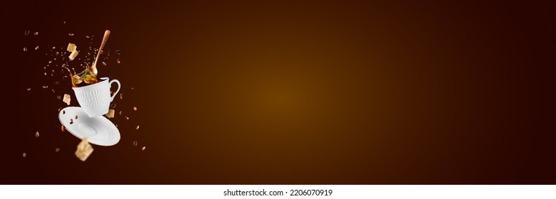Falling coffee cup. Cup of coffee splashes while falling. Splash in white coffee cup. Hot beverage splashing, food levitation