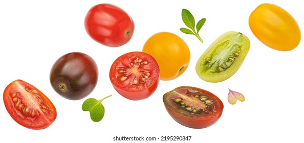 Falling colorful cherry tomatoes isolated on white background