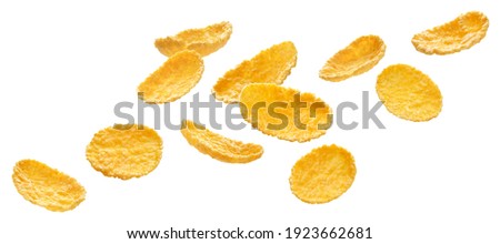Falling corn flakes isolated on white background with clipping path