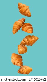 Falling Croissants On Color Background