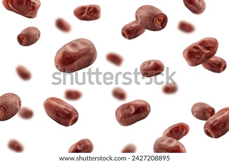 Falling Dates isolated on white background, selective focus