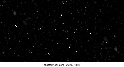 falling down real snow, snowstorm weather stock image on black background