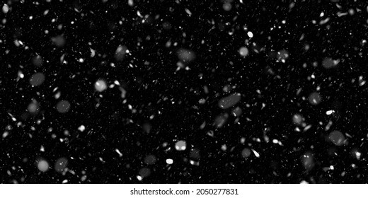 falling down real snow, snowstorm weather stock image on black background