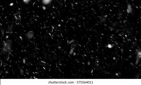 Falling down real snowflakes, heavy snow, snowstorm weather, shot on black background, matte, wide angle, isolated, perfect for digital composition, post-production. - Shutterstock ID 575564011