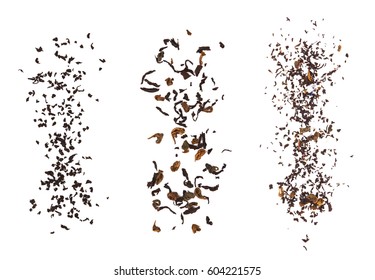 Falling dried tea leaves isolated on white background.