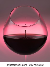 A falling drop of red wine in a glass