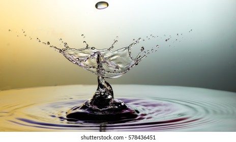 Falling drops of water. Splash effect after collision a falling drops with water Surface