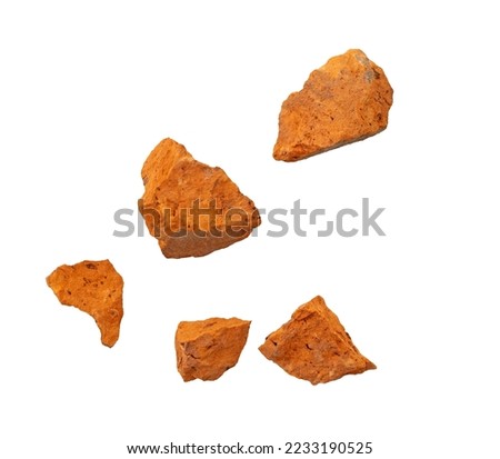 Falling flying pieces of broken red brick isolated on white, clipping path