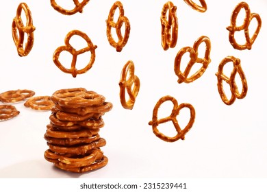 falling or flying Salted Baked snack  brown Pretzel food on white background