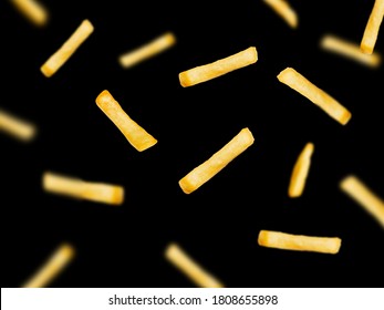 Falling French fries isolated on black background.