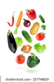 Falling Fresh Color Vegetables On White Background