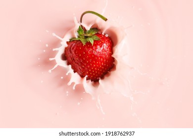 Falling of fresh strawberry into milk - Powered by Shutterstock