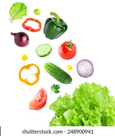 Falling Fresh Vegetables On White Background