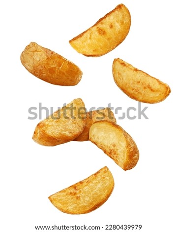 Falling fried Potato wedges, isolated on white background, clipping path, full depth of field