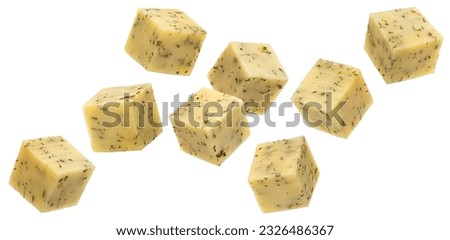 Falling Gouda cheese cubes with herbs isolated on white background